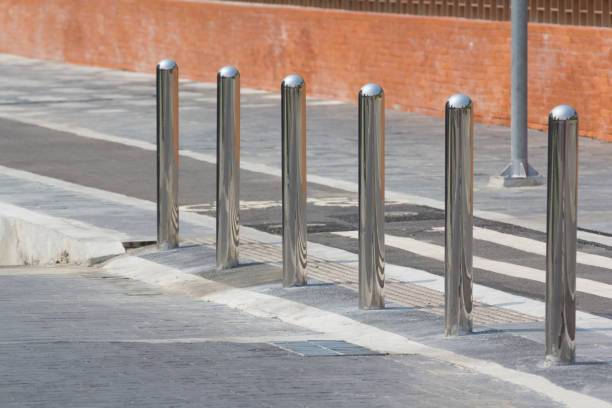 istock stainless steel bollards on footpath. 1252364236