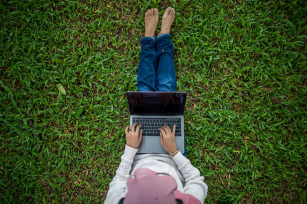 istock Beautiful asian women using laptop outdoor 1252364349