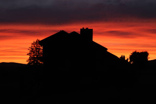 istock Fiery sunset behind the house 1252366116
