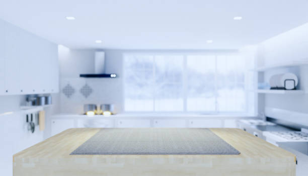 istock Wood countertop product display and blurred kitchen background. 1252366373