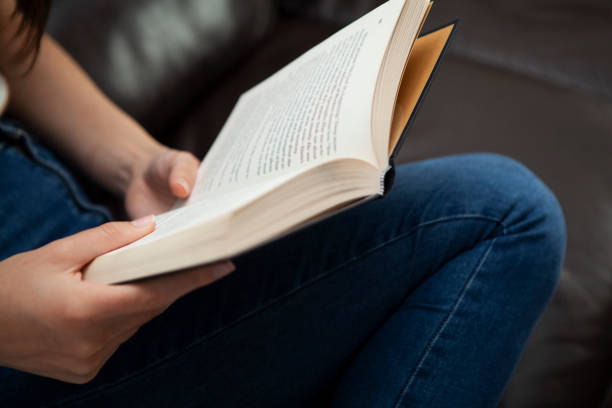 istock Close-up of hands holding a book 1252369347