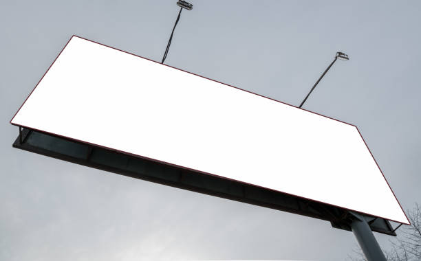 istock advertising panel with space for template and metal poles against clear sky 1252380008