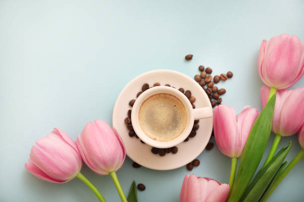 istock Cup of coffee on blue background 1252380330