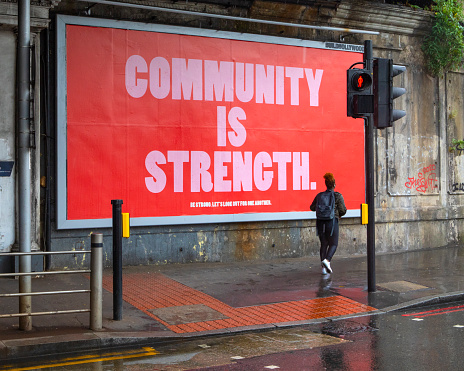 London, UK - June 17th 2020: A poster with the message Community is Strength on display near London Bridge station in London, UK.