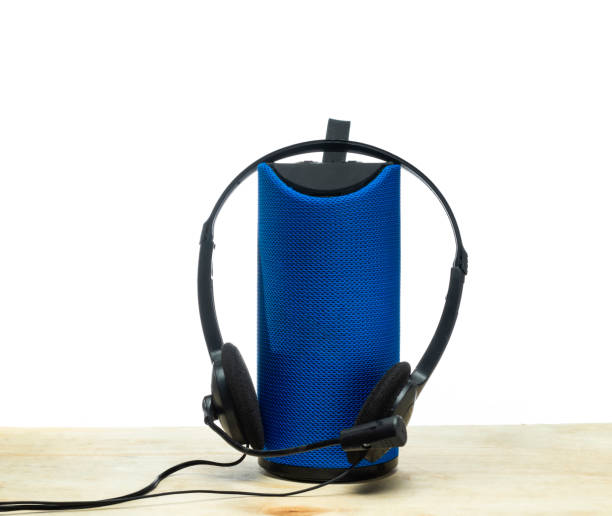 istock Black headphones with blue Small speaker 1252383749
