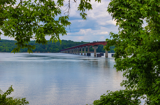 Scenic view from the banks of the Tennessee River and the bridge that crosses it on the Natchez Trace parkway in Tennessee