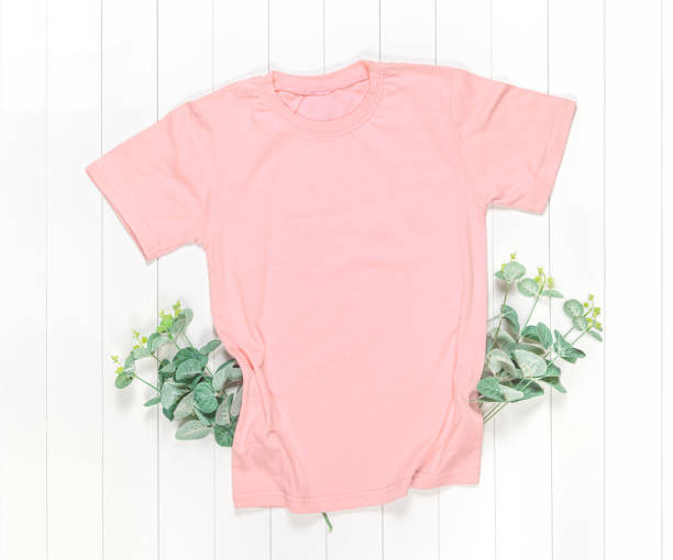 istock Peach Color T-Shirt Mockup on White Background 1252385614
