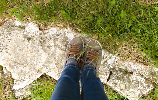 High Angle view of Legs Wearing Fashionable Sneakers