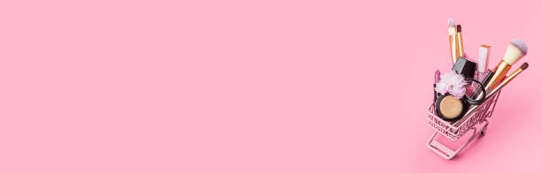istock Cosmetic products on pink background. Horizontal web banner with copy space, mockup, template 1252388945