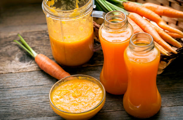 istock fresh organic smoothie and ripe carrot juice 1252392208