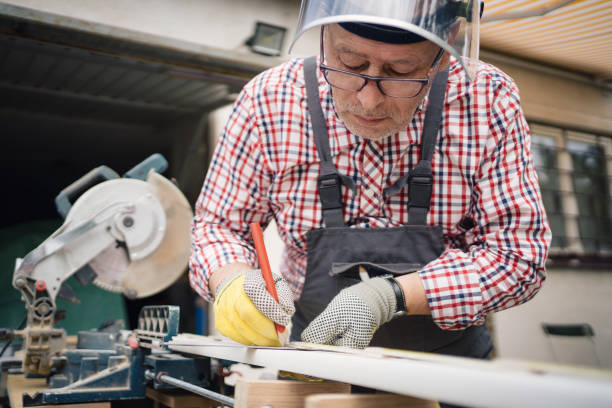istock A carpenter marks a wooden plank 1252394257