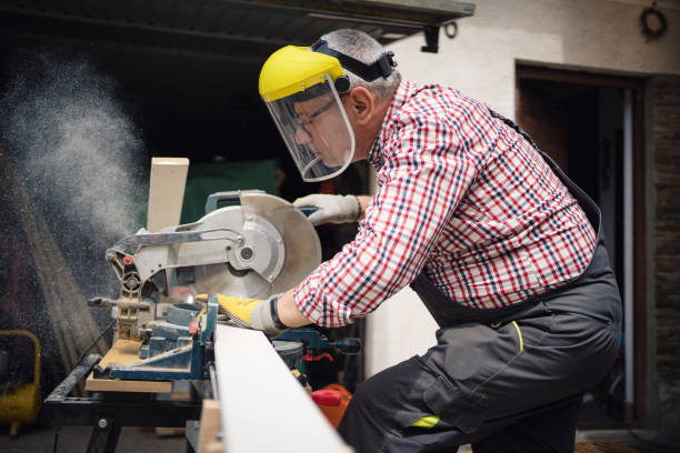 istock A carpenter cuts a wooden board 1252394333