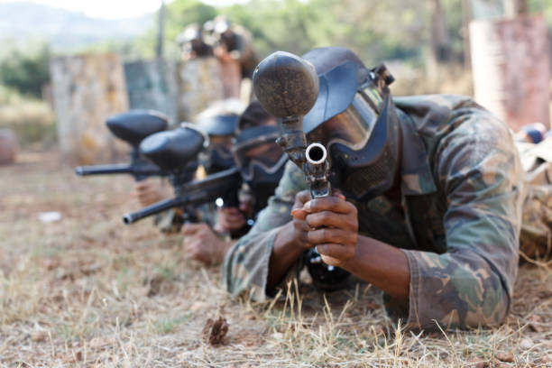 istock Team playing paintball outdoor 1252394517