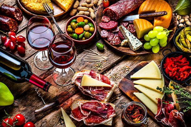 istock Delicious appetizer with red wine on rustic wooden table 1252394788