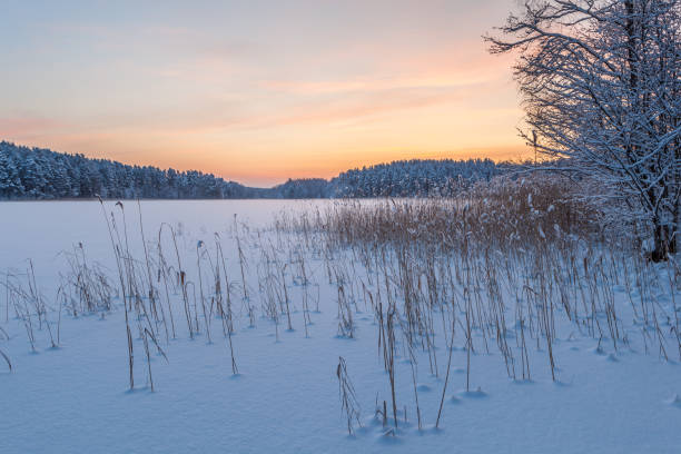 istock Sunrise on a winter, frozen lake. 1252398240