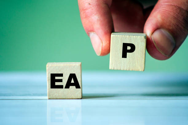 istock EAP symbol. Word EAP on wooden cube. Hand hold one cube. 1252402035