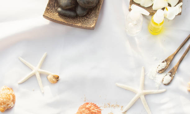 istock Starfish, shell, lava stone, stone, massage, essential oil Placed on white cloth 1252403161