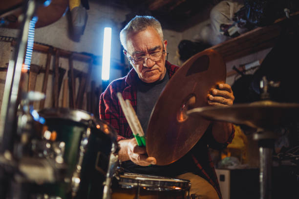 istock An older man practices playing bunje - Remembering the younger days - Happy older man 1252404553