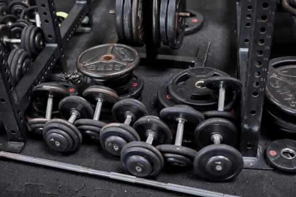 istock Rack with dumbbells ready for workout. Gym equipment 1252404817