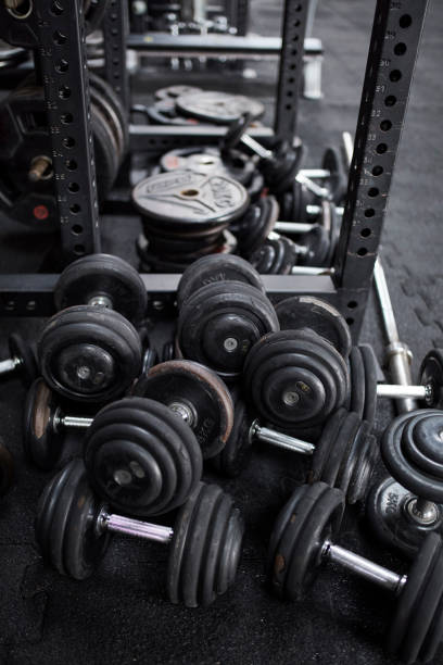 istock Rack with dumbbells ready for workout. Gym equipment 1252405036