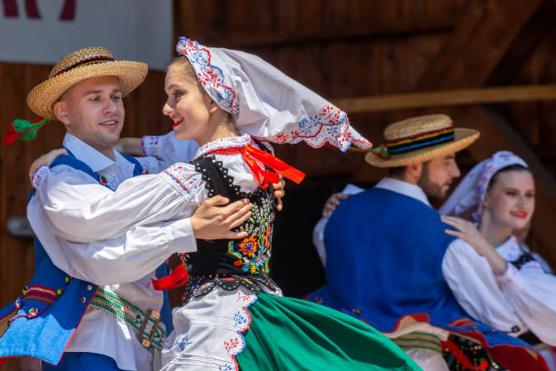 Dancers from Poland in traditional costume Timisoara: Dancers from Poland in traditional costume perform at the international folk festival, International Festival of hearts, organized by the City Hall. polish culture photos stock pictures, royalty-free photos & images