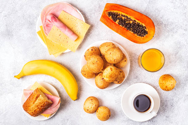 istock Traditional Brazilian breakfast - cheese bread, coffee, ripe fruit, top view 1252406422