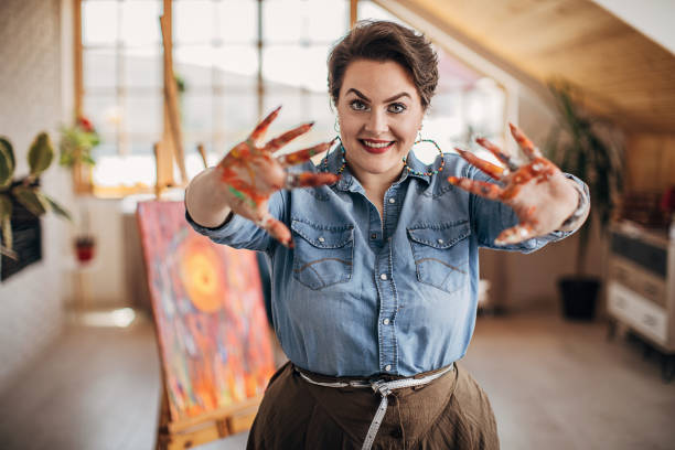 istock One young female artist with painted hands 1252407651