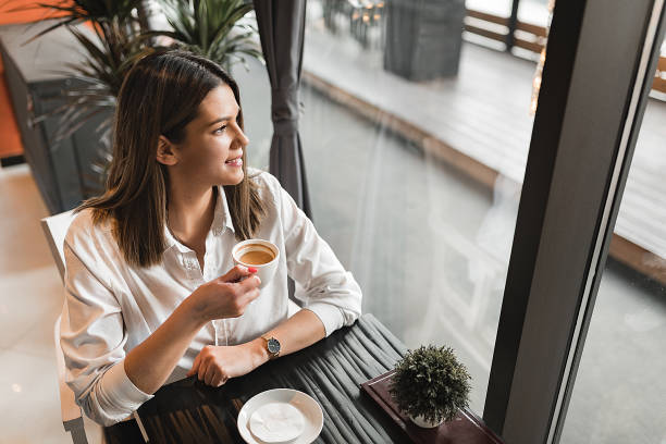 istock Woman in coffee shop 1252407721