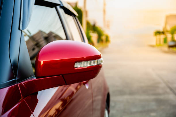 istock Wing mirror on red car with turn signal. 1252408384