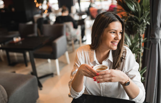 istock Woman in coffee shop 1252408393