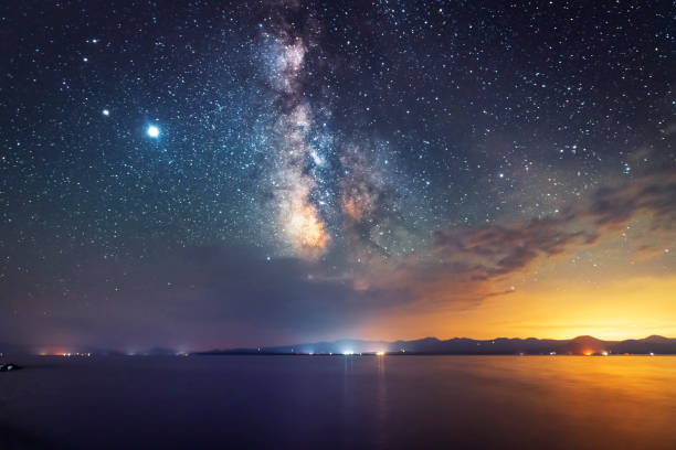 istock Beautiful night landscape. Beautiful Sevan lake in the night and bright milky way galaxy. Night photography. National park 1252408395