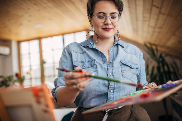 istock One female painter painting in her studio 1252408561
