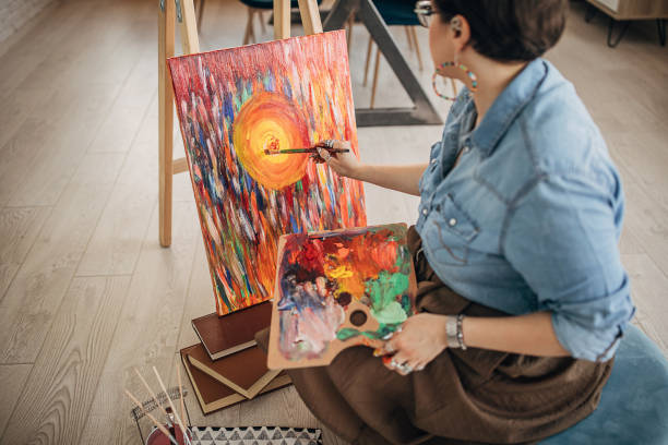 istock Female artist working in her studio 1252409180