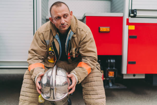 Firefighter after work Firefighter feeling exhausted after hard day chief of staff stock pictures, royalty-free photos & images