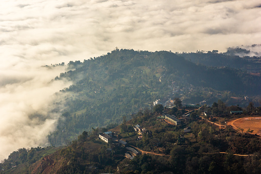 An aerial view of a river of mist and fog hitting the hills around the town of Tansen in Nepal.
