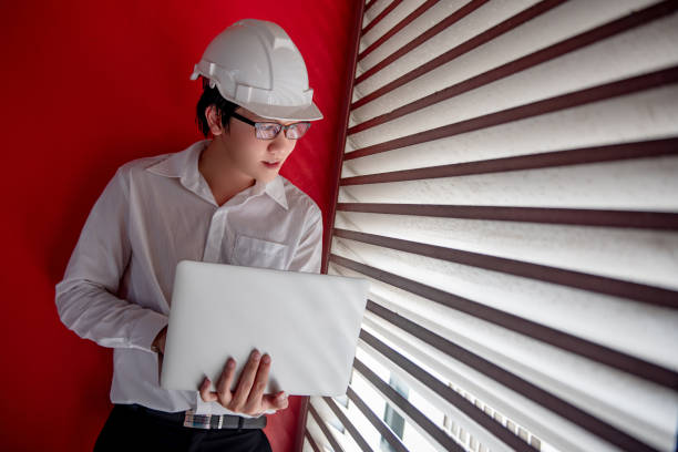 istock Asian civil engineer man working at construction site 1252411612