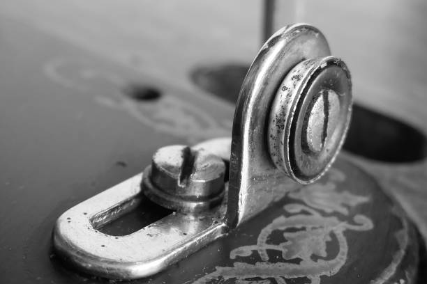 Macro detail photos of a classic manual sewing machine in color and black and white.