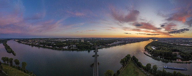 Panoramic aerial picture of Mainspitze area with Main river mouth and city of Mainz in Germany during sunset