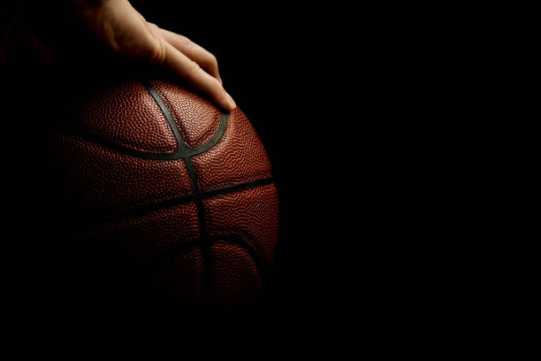 Mans Hand Palming Basketball Isolated On Black Background Room For Text  Stock Photo - Download Image Now - iStock