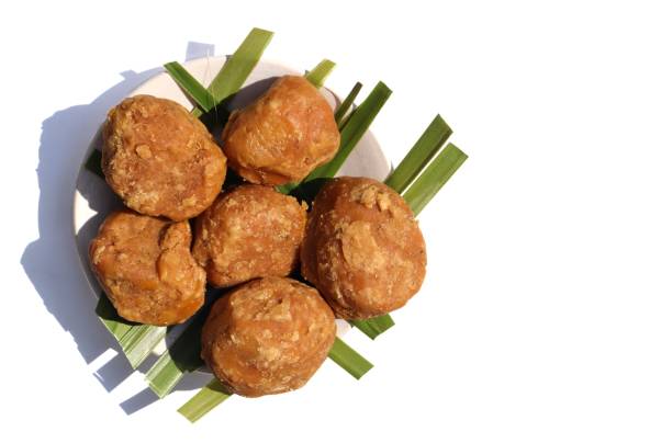 istock Sweet Palm Jaggery in a Plate Isolated on White Background with Copy Space 1252414167