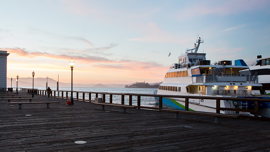 Docked Ferry Against Sunlight At San Francisco Pier
