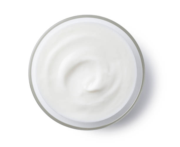 istock Yogurt in a glass bowl set against a white background 1252414273