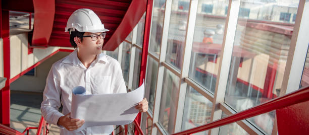 istock Asian civil engineer man working at construction site 1252415204