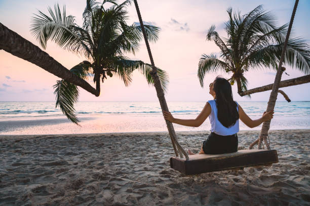 istock Woman on swing in beach 1252416794