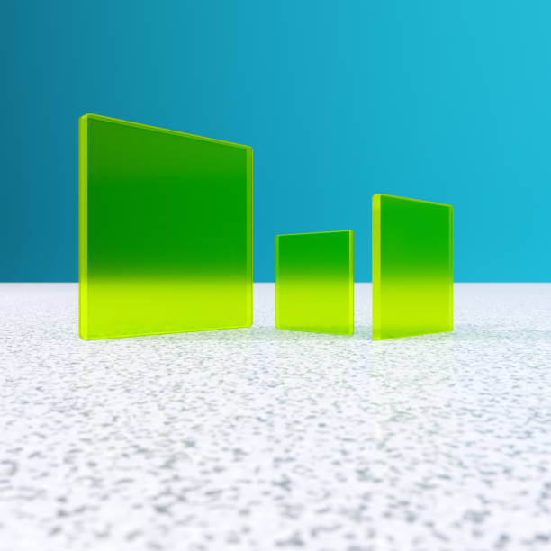 Three green glass tiles against a blue background