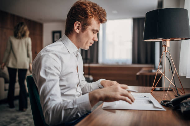 istock One young businessman working from hotel room 1252418590