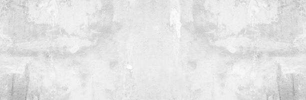 istock Panoramic grey paint limestone texture background in white light seam home wall paper. Back flat wide concrete stone table floor concept surreal granite quarry stucco surface grunge panorama landscape. 1252419033