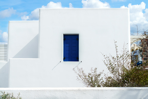 White architecture on Santorini island, Cyclades, Greece. White buildings with blue windows.