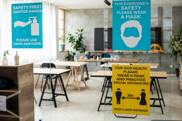 istock Empty classroom with information about covid-19 illness prevention and safety on classroom entrance 1252420219