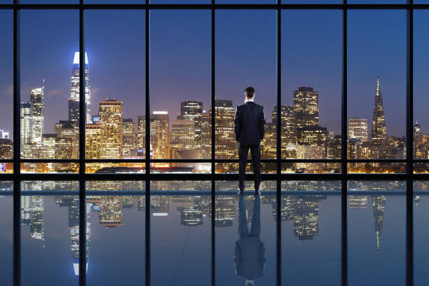 istock Businessperson looking into distance on rooftop 1252420726